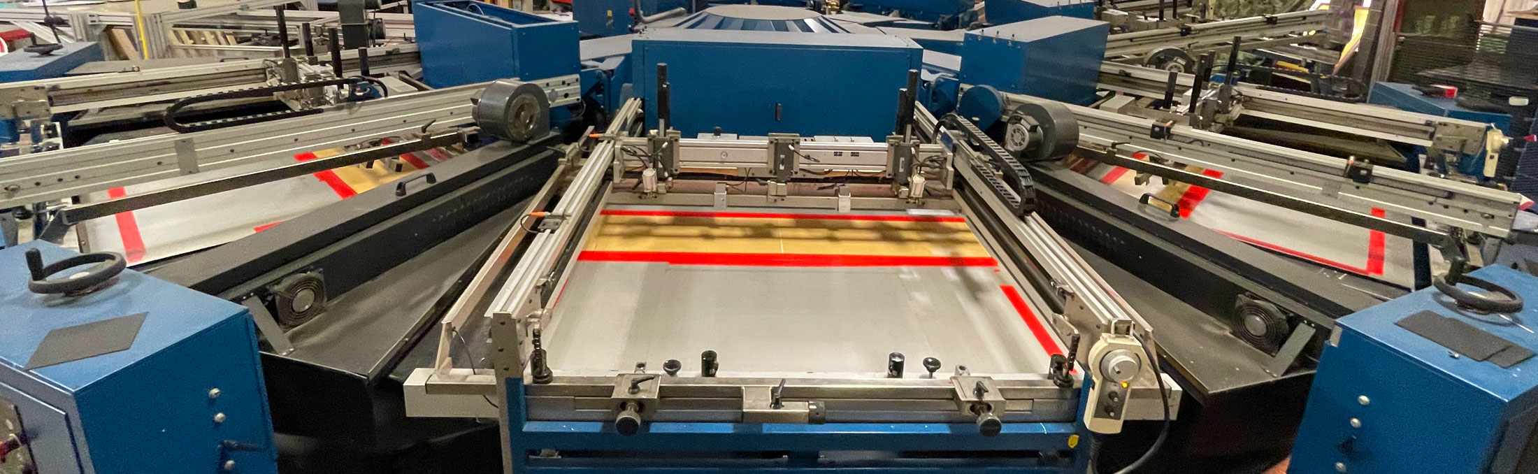 Screen printing press at Interstate Graphics